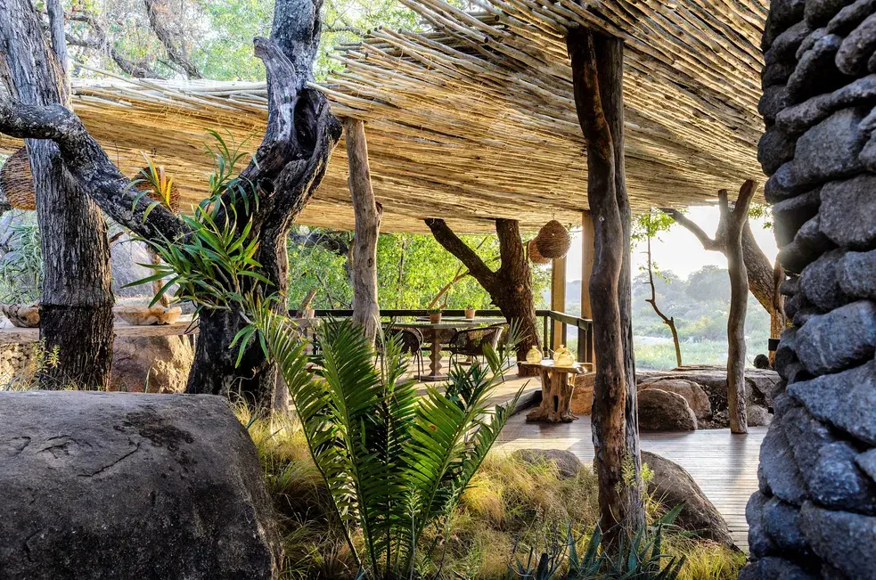Outdoor dining patio at Singita Boulders Lodge