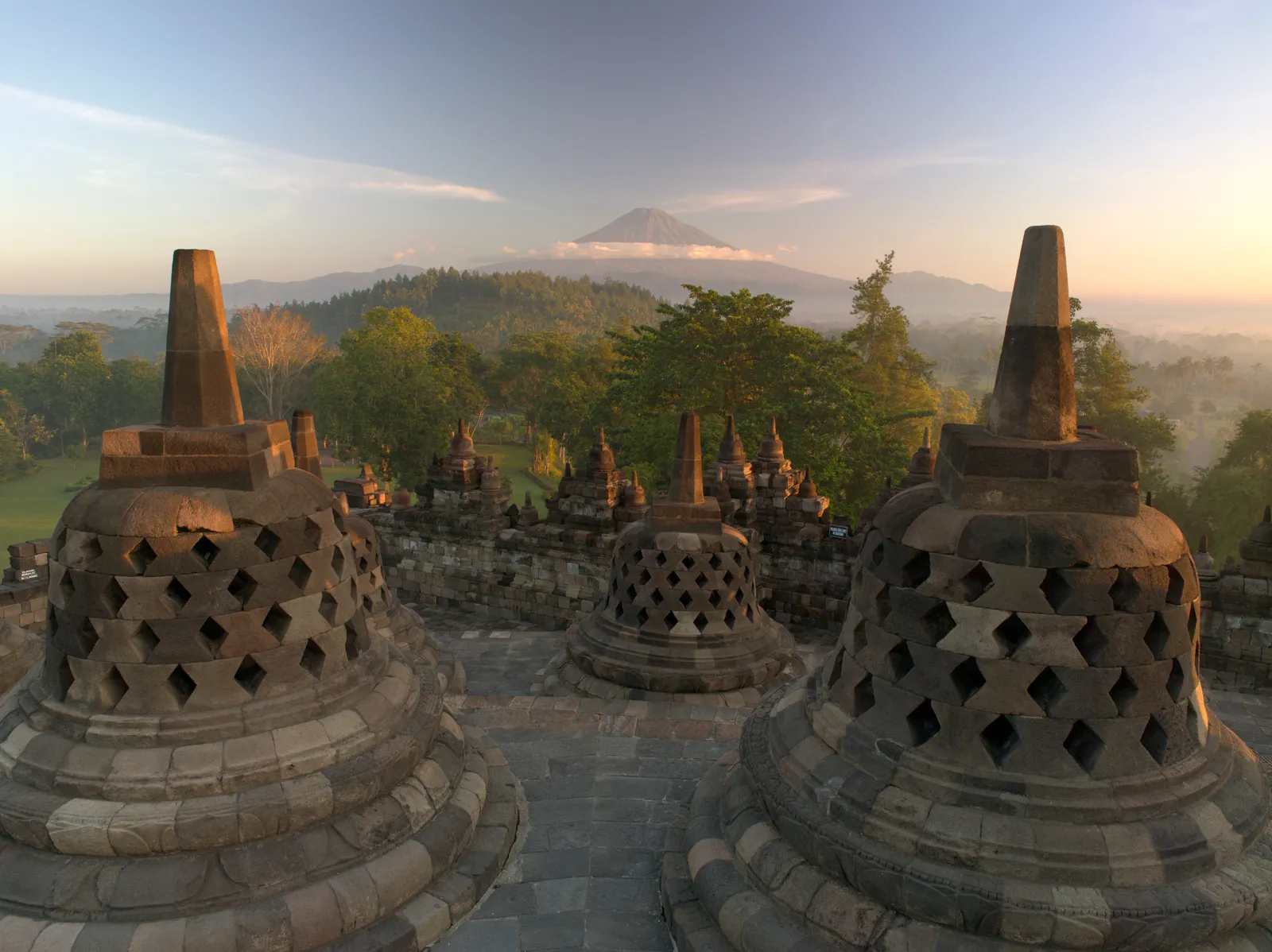 Borobudur temple at sunrise, the ninth-century Buddhist monument guests visit from Amanjiwo.