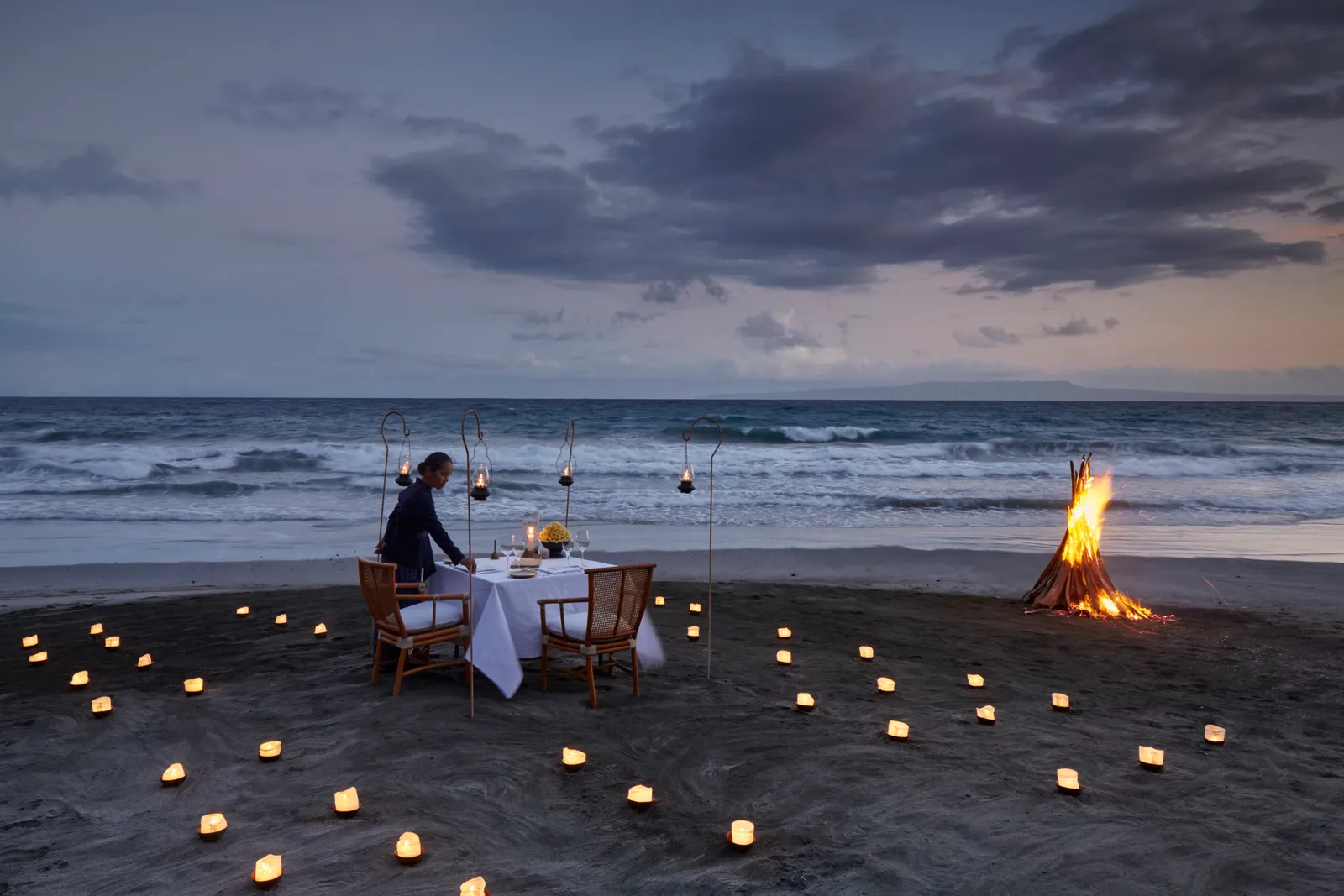 Private beach dinner setup at Amankila