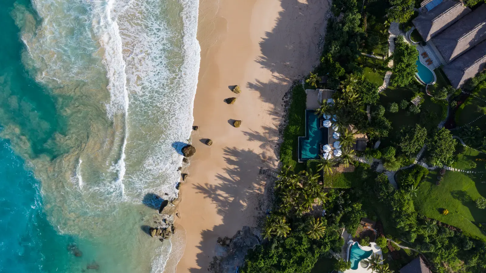 Aerial view of a secluded cove near NIHI Sumba