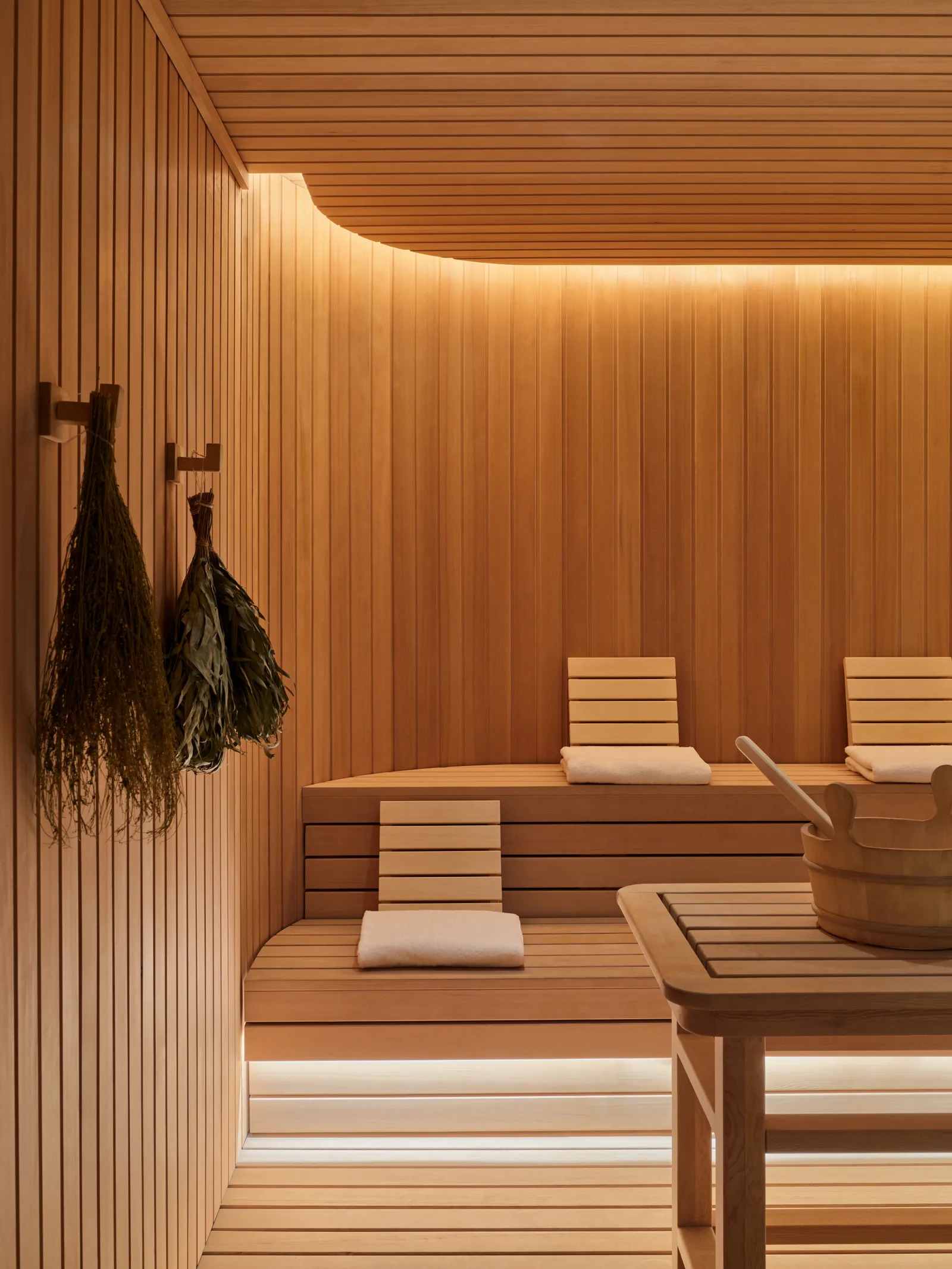 Wood-lined banya wellness room at Aman New York