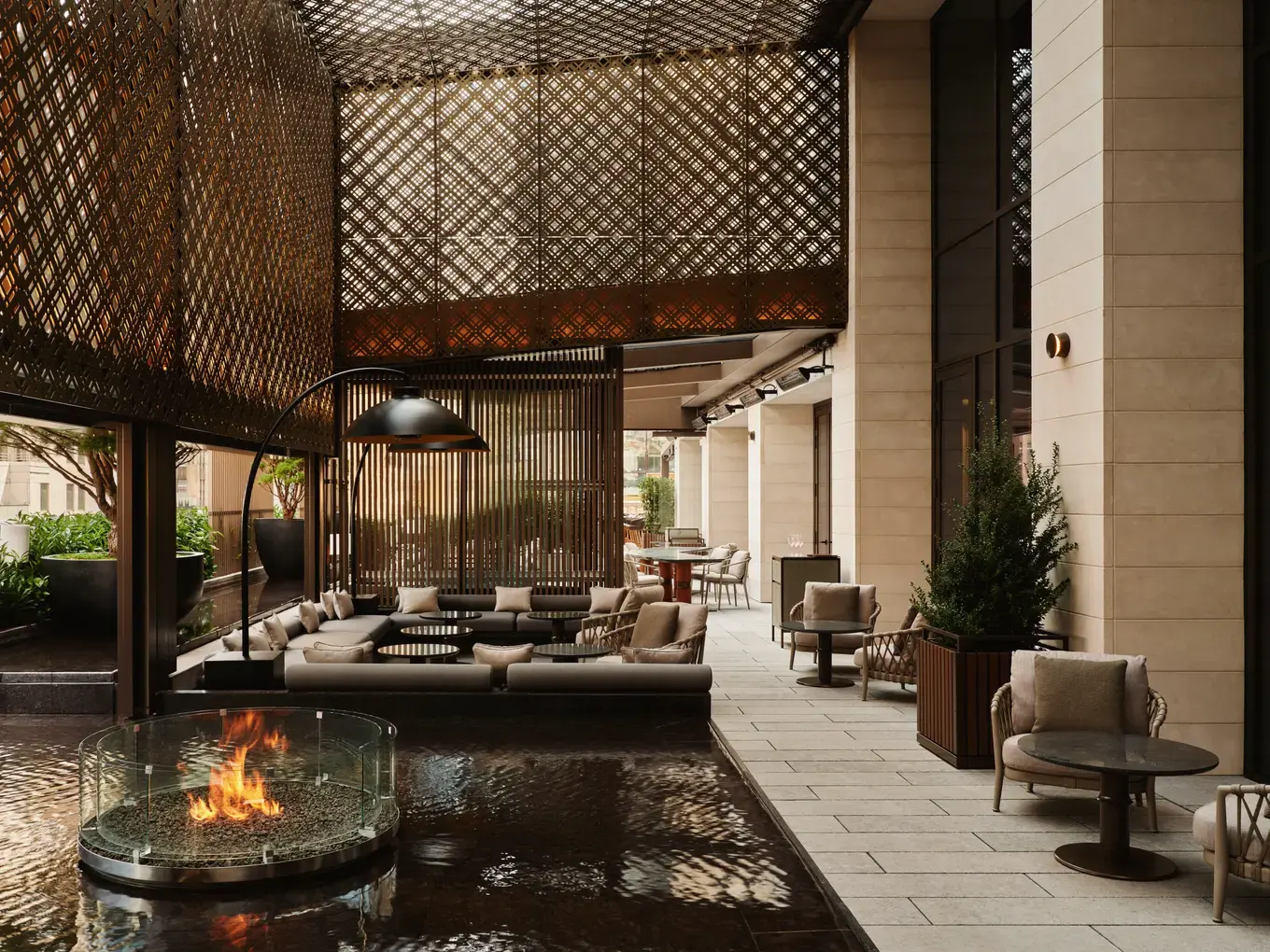 Aman New York Garden Terrace with a fire feature, water, and outdoor seating
