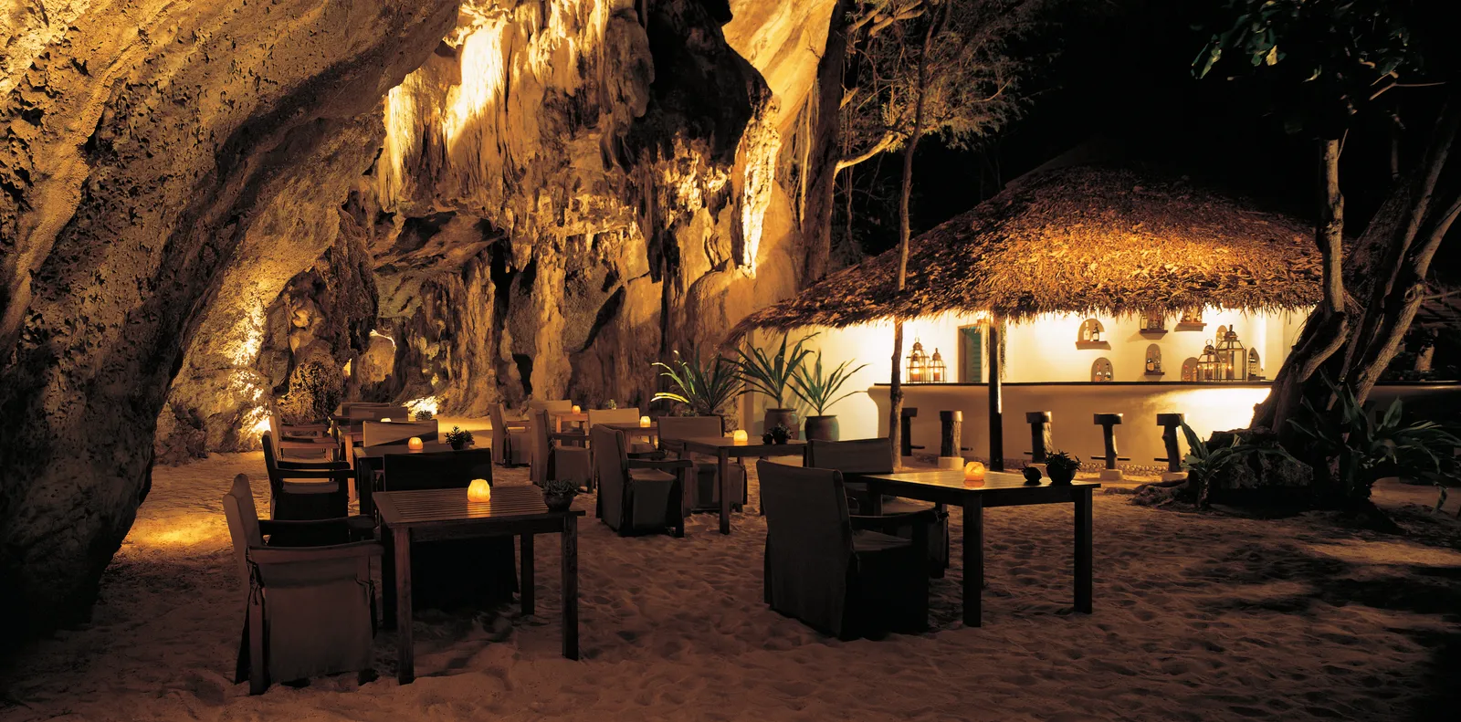 The Grotto, Rayavadee's cave-set beachfront restaurant and bar, lit at night.