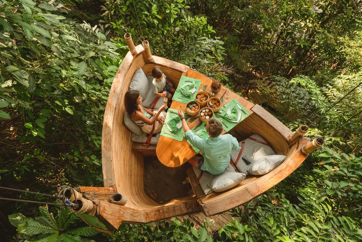 TreePod Dining suspended in the jungle canopy at Soneva Kiri