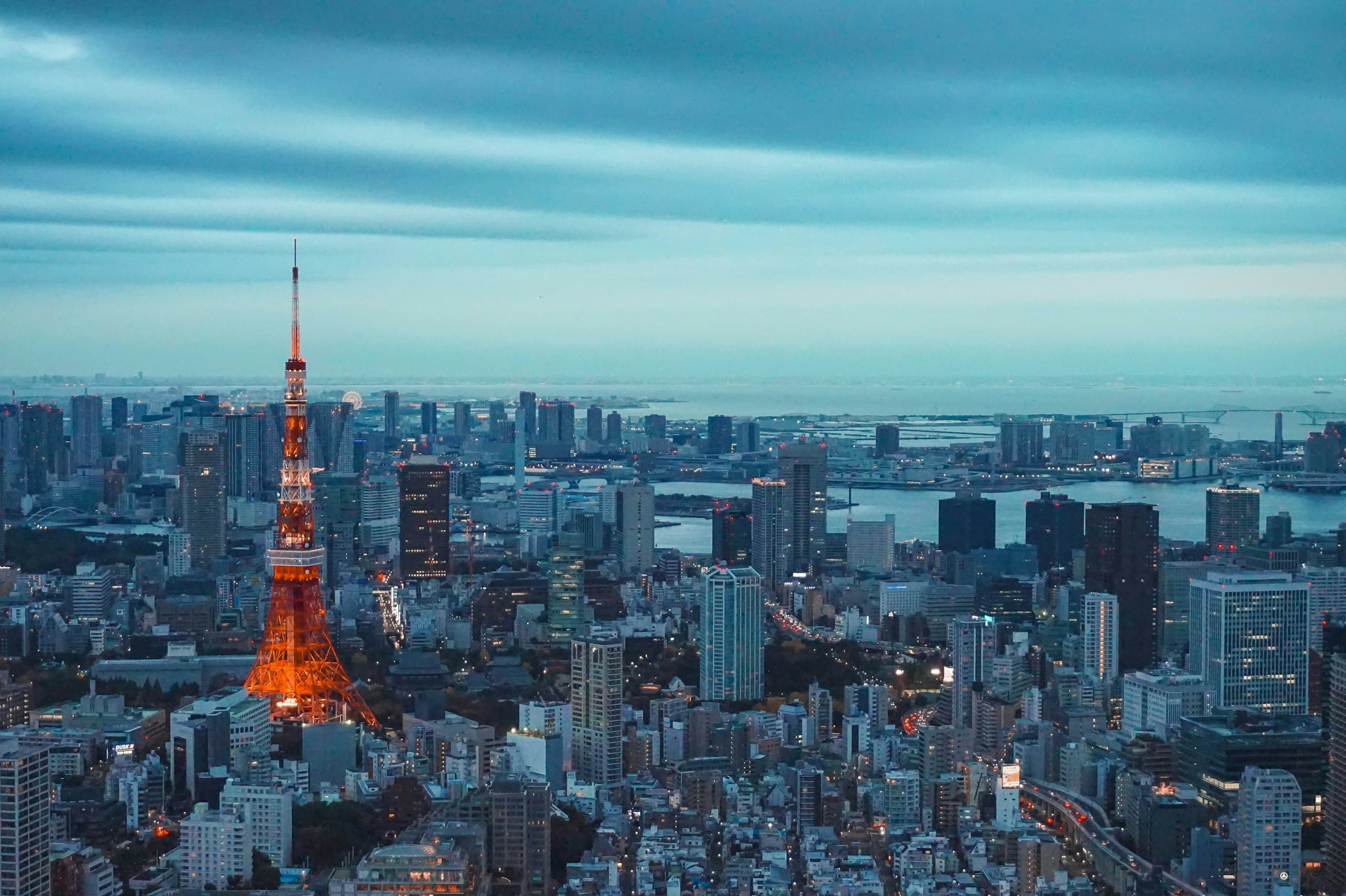 Tokyo Tower and skyline at dusk representing the Bulgari Hotel Tokyo bucket-list shortlist.