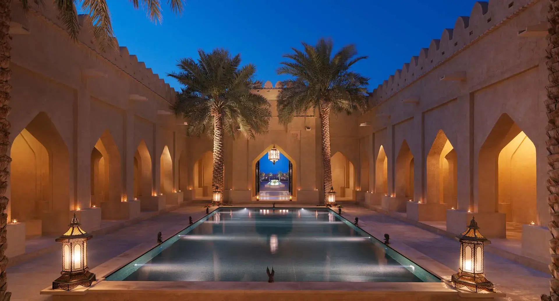 Qasr Al Sarab Desert Resort courtyard lit at night in the Liwa desert