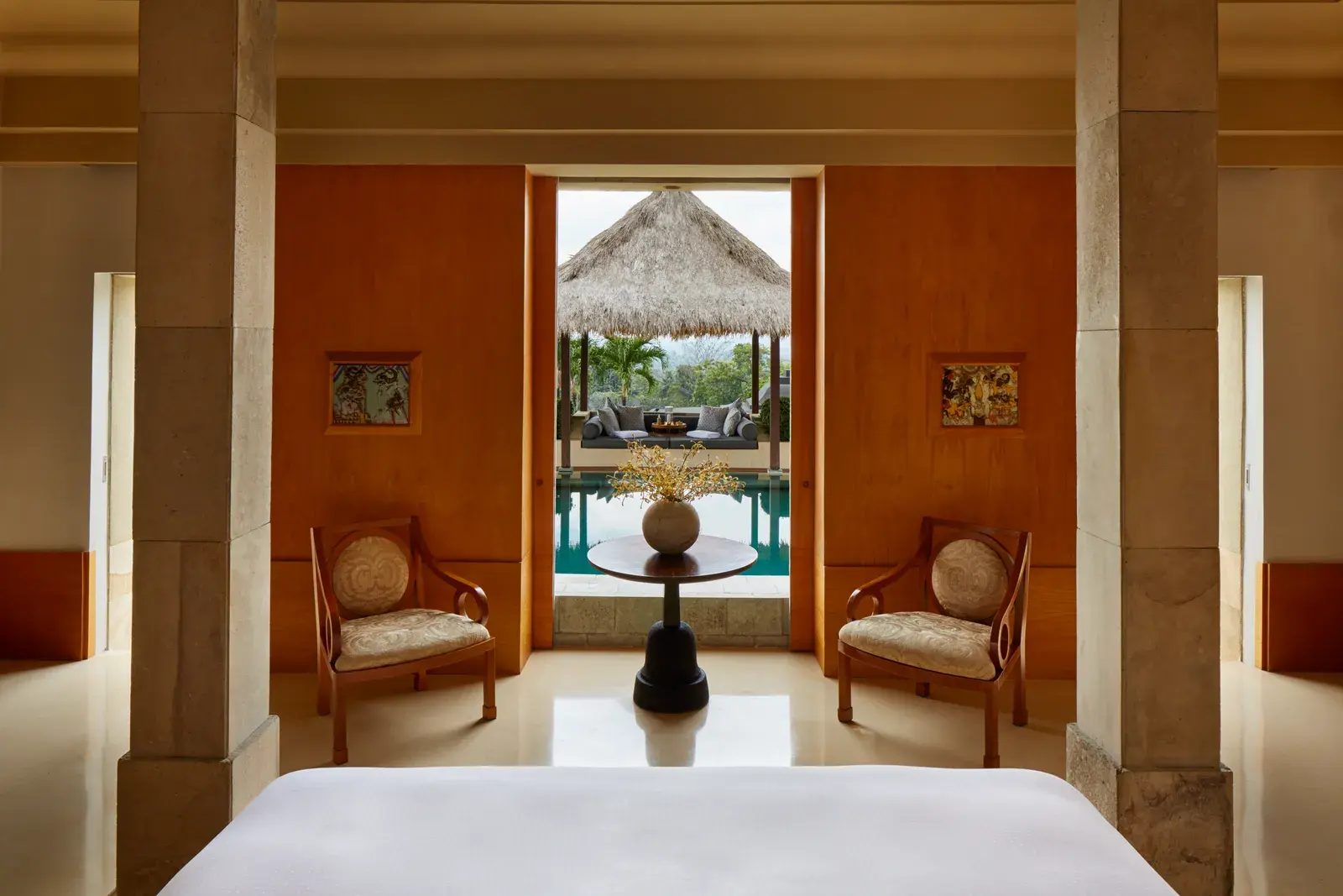A Borobudur Suite's private pool terrace at Amanjiwo with a view toward Borobudur temple.