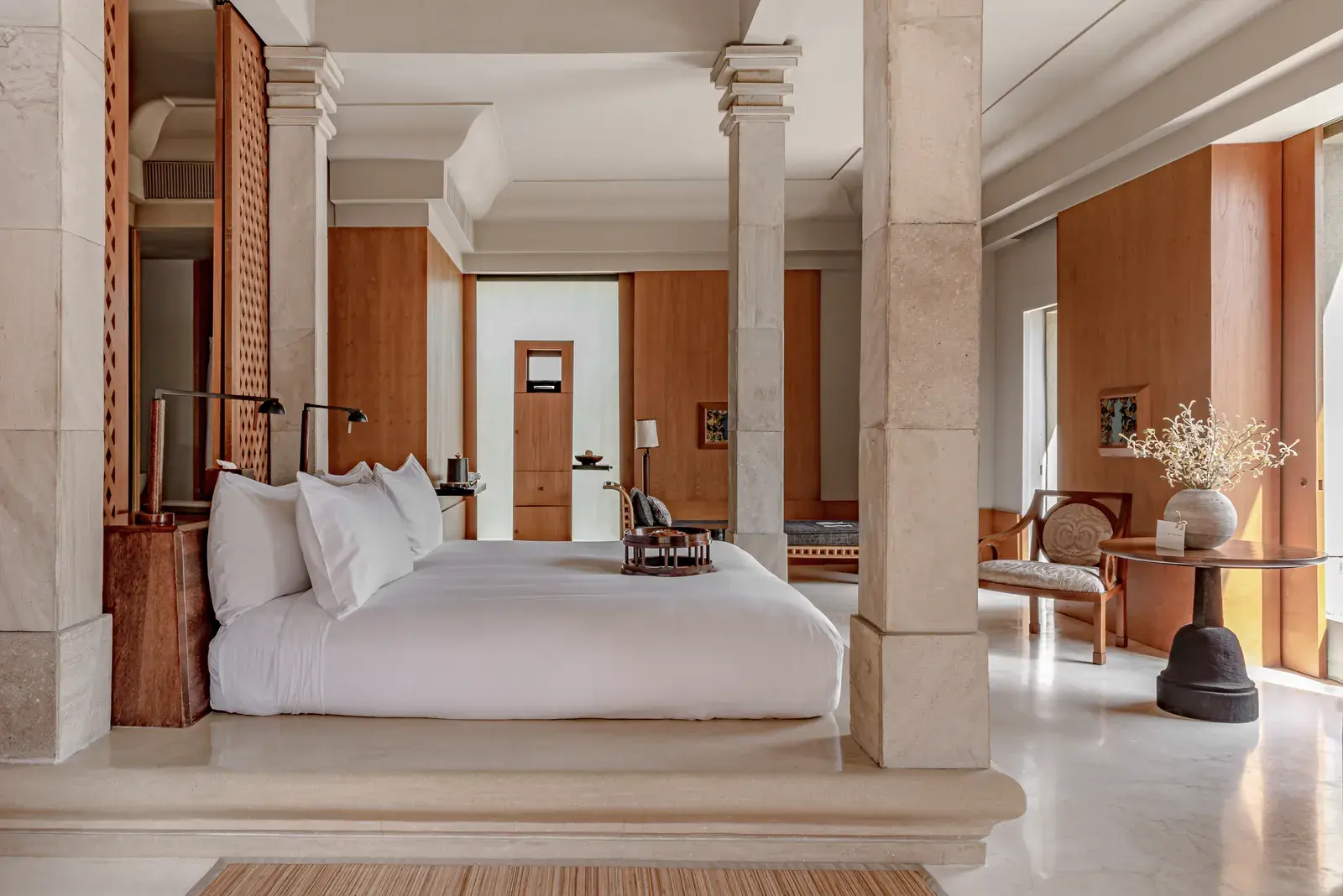 A suite bedroom at Amanjiwo with locally made furnishings and a domed ceiling.