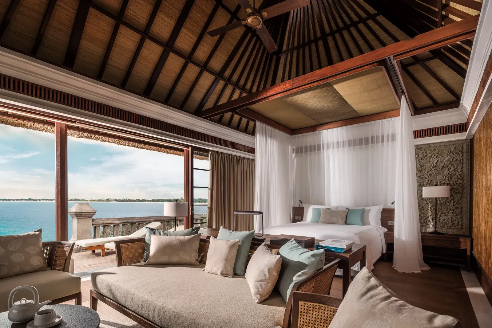 Bedroom with ocean view canopy bed at Four Seasons Bali at Jimbaran Bay