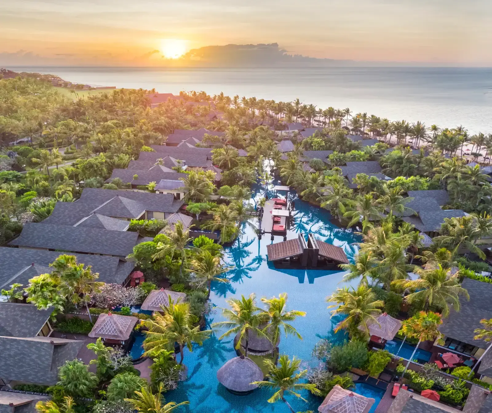 Aerial view of the lagoon pool and beachfront at The St. Regis Bali Resort.