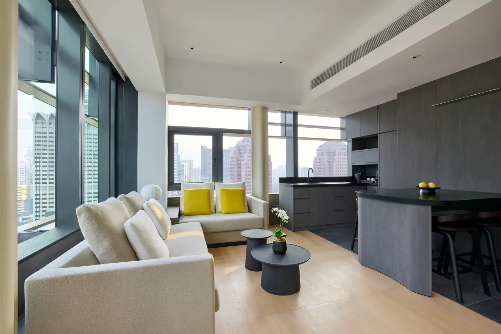 Metropolitan Suite living room with skyline view at COMO Metropolitan Singapore