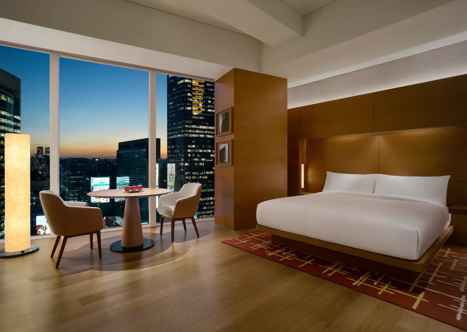King room with floor-to-ceiling windows and evening city views at Park Hyatt Seoul
