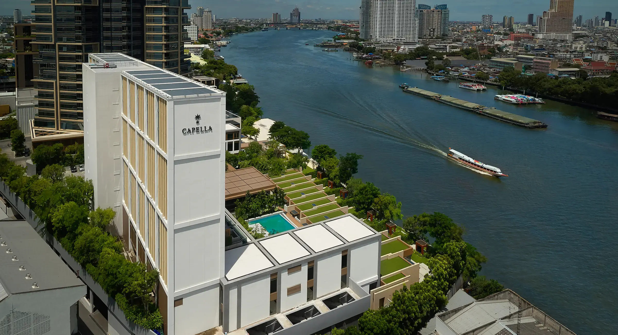 Capella Bangkok's riverfront facade beside the Chao Phraya River