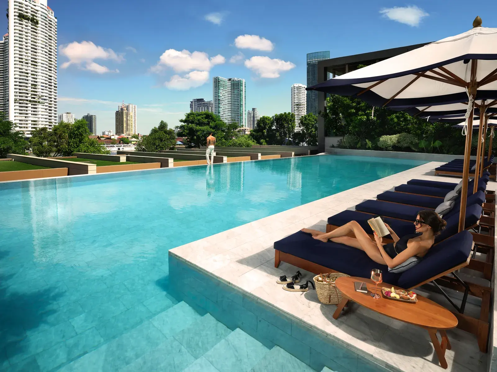 Riverside swimming pool and sun terrace at Capella Bangkok