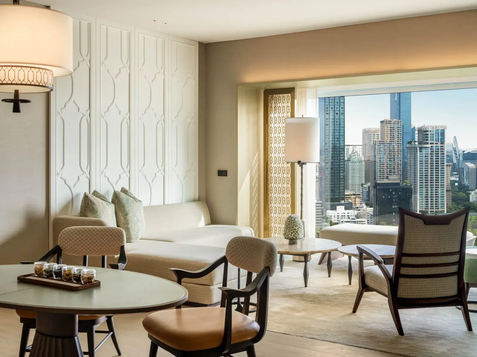 Club Suite living area at Dusit Thani Bangkok with park-view windows over Lumpini Park