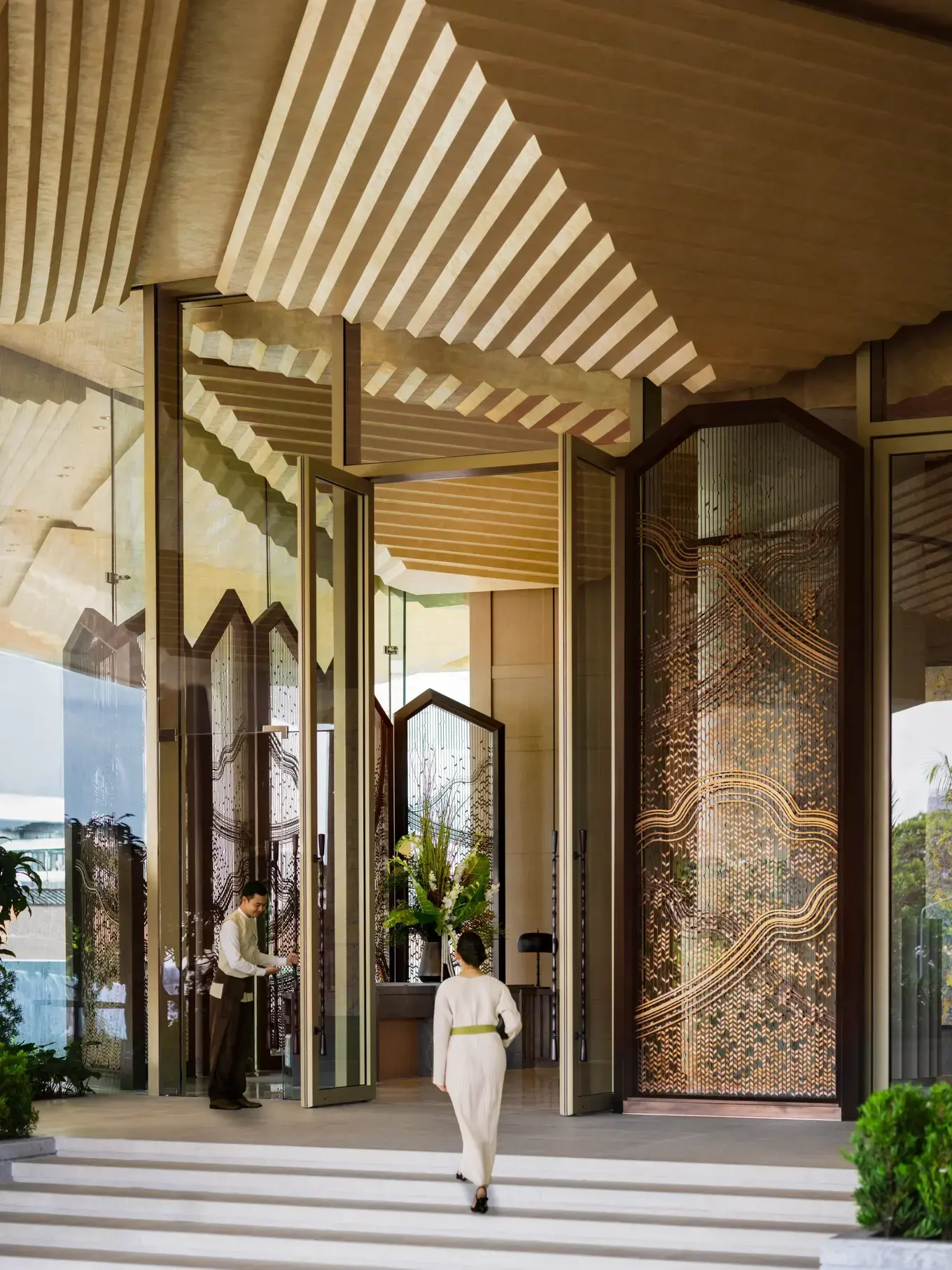 Entrance facade of Dusit Thani Bangkok on Rama IV Road, Silom, with its landmark gold spire