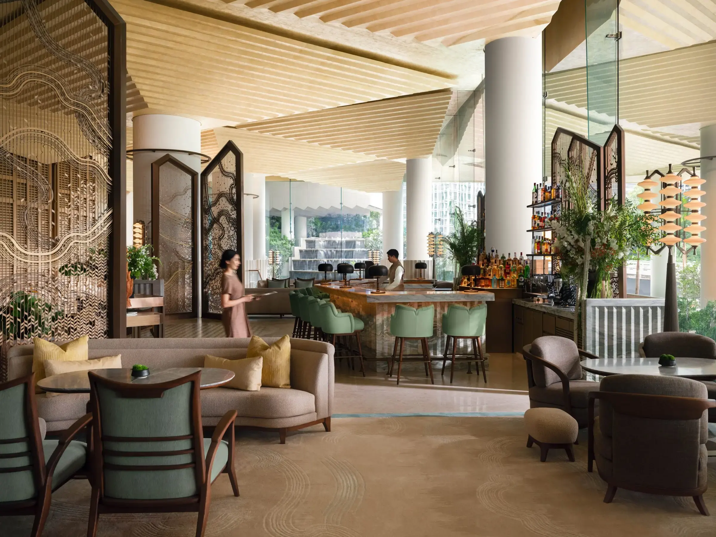 Lobby of Dusit Thani Bangkok with contemporary Thai design details and high ceilings