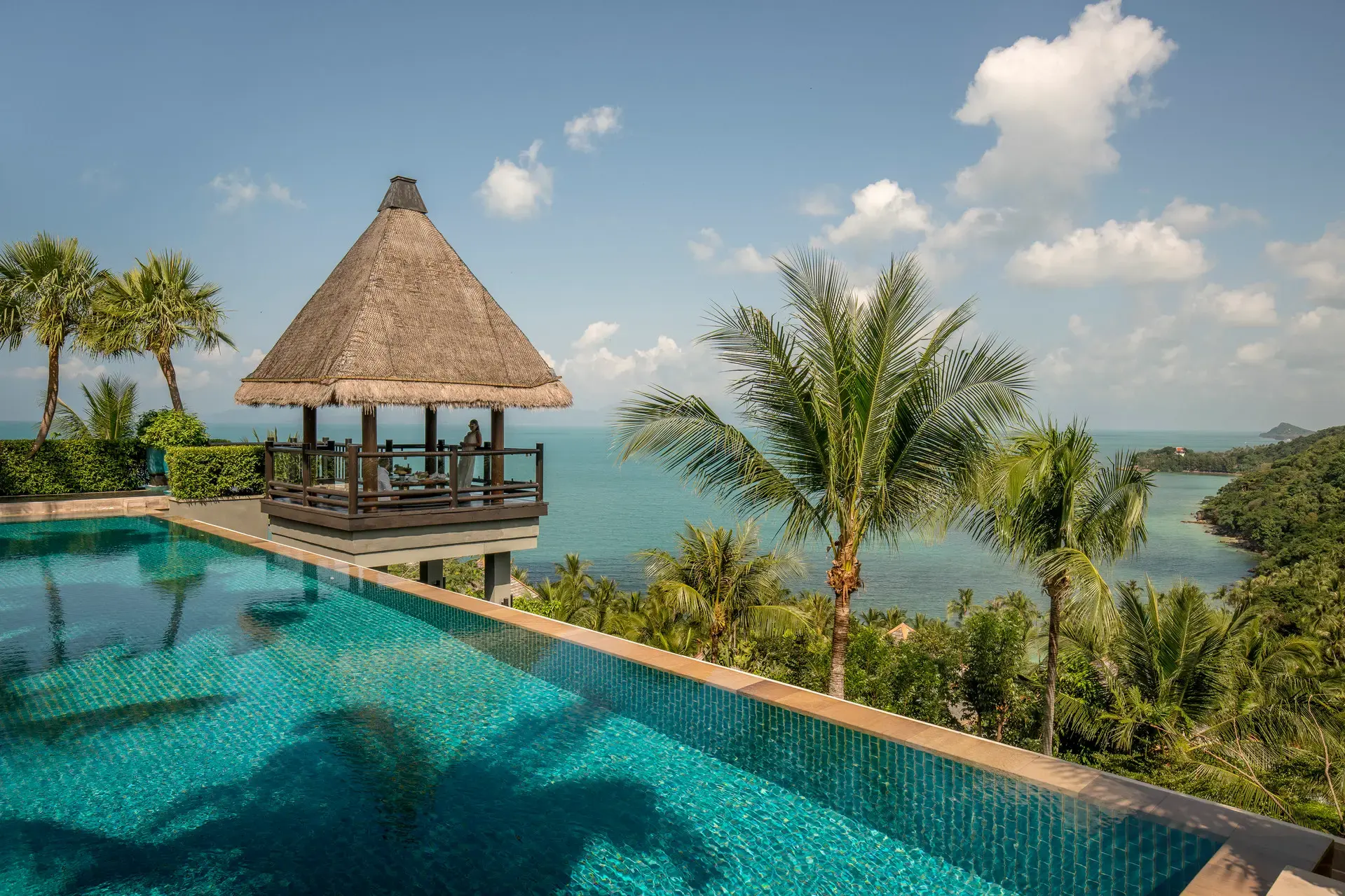Pool pavilion with palm trees at Four Seasons Resort Koh Samui