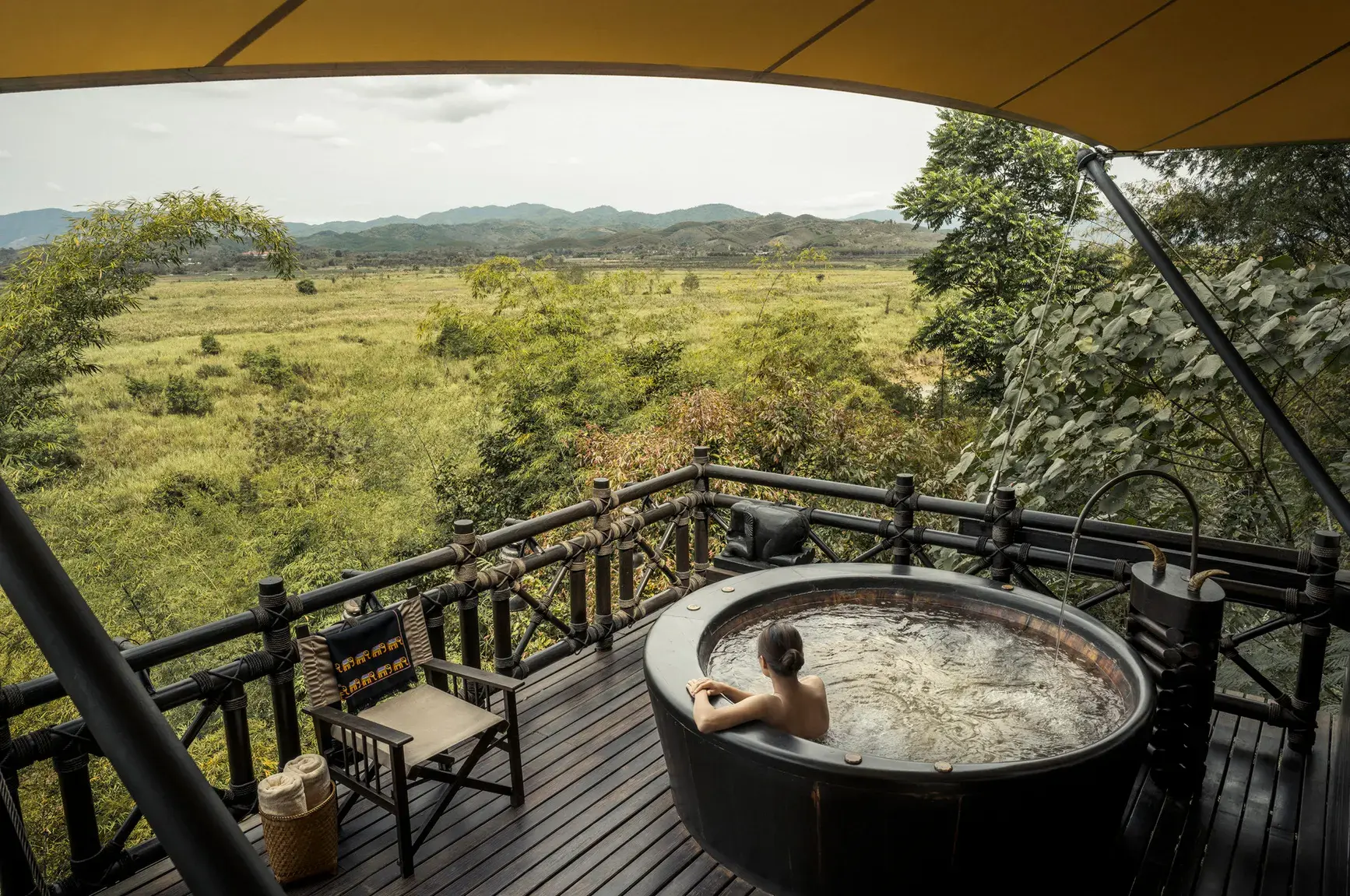 Elevated deck view over the jungle and river at Four Seasons Tented Camp Golden Triangle