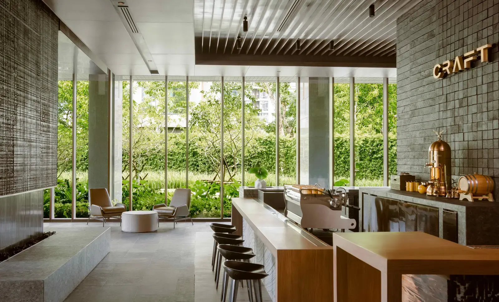 CRAFT restaurant dining room at Kimpton Maa-Lai Bangkok with garden views