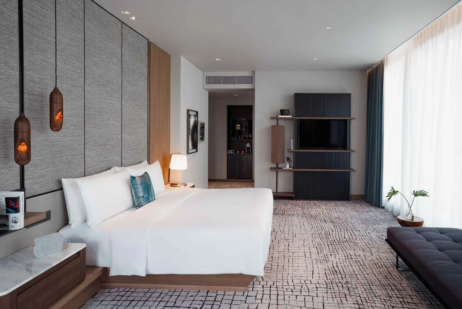 Bedroom of the Maa-Lai Suite with Green Lung View at Kimpton Maa-Lai Bangkok