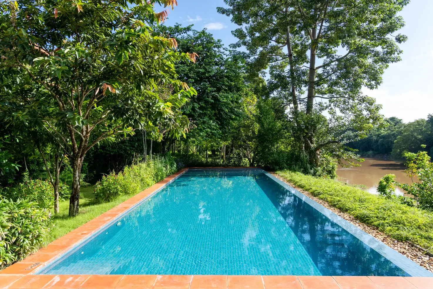 Infinity pool overlooking the Ping River valley at Raya Heritage Chiang Mai