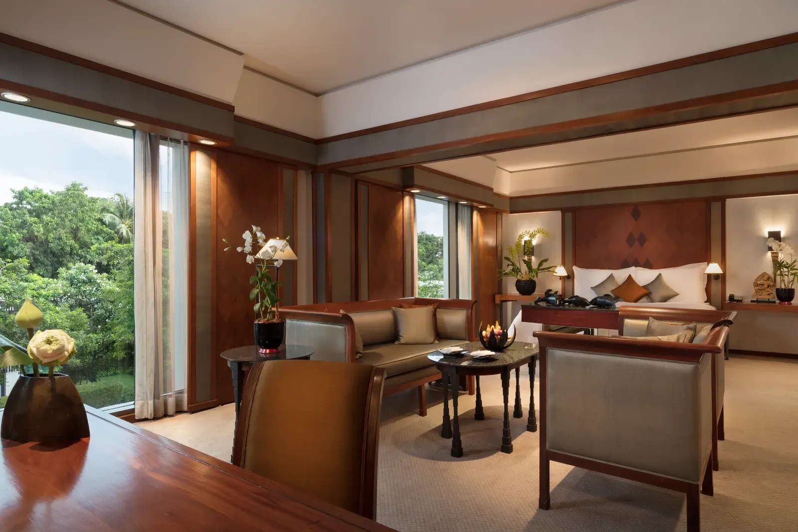 Executive Suite bedroom at The Sukhothai Bangkok with teak-and-silk interiors