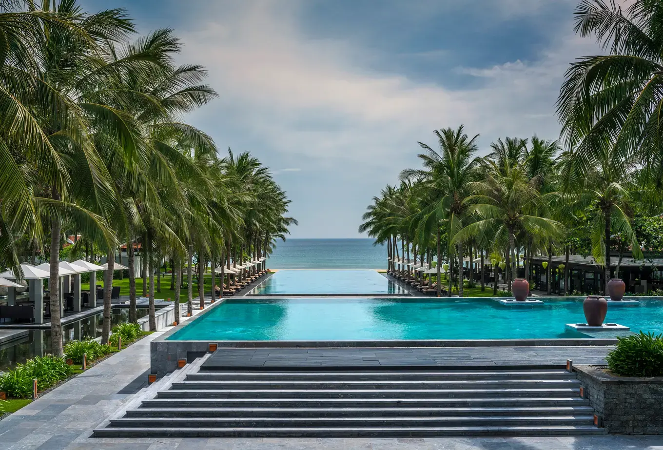 Sunset pool view at Four Seasons Resort The Nam Hai, Vietnam