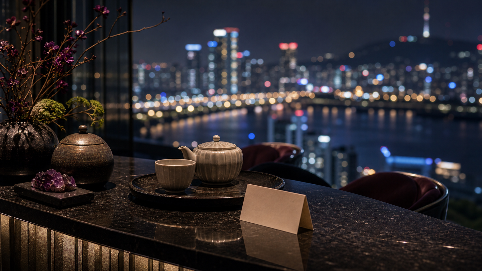 Seoul, South Korea shown as Seoul high-floor tea lounge close-up for VIAIVE, with ceramic tea, black stone, Han River bokeh.