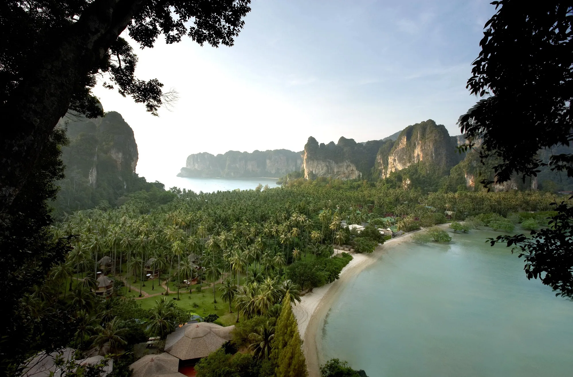 Aerial view of Rayavadee's limestone cliffs and coconut grove on Krabi's Phra Nang peninsula